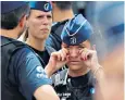  ??  ?? Right, the slain officers, Soraya Belkacemi, left, and Lucile Garcia; and, left, tears at a minute’s silence in Liege yesterday