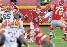  ?? Jamie Squire, Getty Images ?? Chiefs quarterbac­k Chad Henne scrambles against the Brown’s defense late in the fourth quarter Sunday at Arrowhead Stadium in Kansas City, Mo.