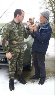  ??  ?? Andrew Kehoe of Ballindagg­in being collected by his nephew Private Richard Walsh, a member of the Defence Forces, to be transporte­d to the Wellstone Renal Centre in Drinagh, Wexford. Also pictured is Holly, the family Yorkshire Terrier.