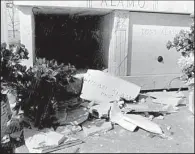  ??  ?? The mausoleum near Dyer where the body of Susan Alamo once lay is shown after it was smashed open in 1991. At right, Susan and Tony Alamo leave federal court in Fort Smith in June 1977 after a custody hearing on some of their adult followers whose...