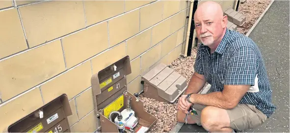  ??  ?? James Kelly beside his gas meter.