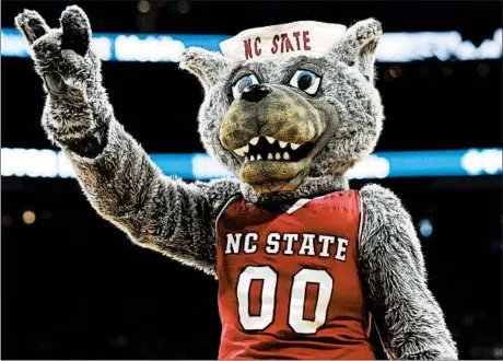  ?? GERRY BROOME/AP ?? North Carolina State has forced at least two other schools to stop using the Wolfpack as their athletic mascot nickname.