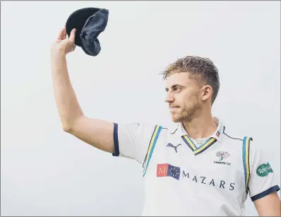  ??  ?? Ben Coad salutes the crowd after being presented with his county cap. “It’s a dream come true,” he said.