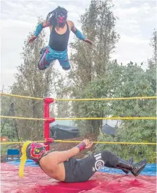  ?? CLAUDIO CRUZ /AGENCE FRANCE-PRESSE ?? MEXICO’S wrestling stars bring act elsewhere during the pandemic.