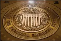  ?? The Associated Press ?? VACANT SEATS: This Feb. 5, 2018, file photo shows the seal of the Board of Governors of the United States Federal Reserve System at the Marriner S. Eccles Federal Reserve Board Building in Washington. Economist Judy Shelton, tapped by President Donald Trump for a seat on the Federal Reserve board, says she does not favor credit tightening by the Federal Reserve that would harm investors.