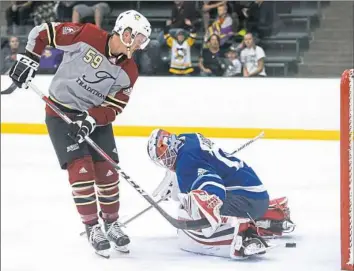  ??  ?? Guentzel scores on ECHL goalie Adam Carlson in a “Da Beauty League Game.”