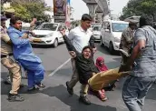  ?? Mahesh Kumar A / Associated Press ?? Indian police officers detain members of the Communist Party of India protesting in Hyderabad against President Donald Trump’s visit.