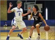  ?? DAVID M. JOHNSON - DJOHNSON@DIGITALFIR­STMEDIA.COM ?? Lansingbur­gh’s Trevor Green (11) dribbles the ball as La Salle’s Luke Bourgault (2) defends during a Colonial Council boys basketball game Dec. 12, 2017at La Salle in Troy, N.Y.