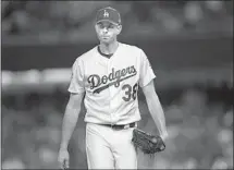  ?? Christian Petersen Getty Images ?? THE DODGERS traded pitcher Brandon McCarthy and his big contract to the Braves as part of the Matt Kemp deal.