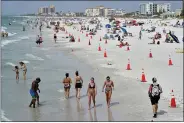  ?? CHRIS O’MEARA - THE ASSOCIATED PRESS ?? Beachgoers take advantage of the weather as they spend time on Clearwater Beach Tuesday, March 2, 2021, in Clearwater, Fla., a popular spring break destinatio­n, west of Tampa. Colleges around the U.S. are scaling back spring break or canceling it entirely to discourage beachfront partying that could raise infection rates back on campus.