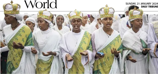  ?? MICHELE SPATARI/GENCE FRANCE-PRESSE ?? ETHIOPIAN Orthodox worshipper­s sing and dance during the celebratio­n of the eve of Timkat, the Ethiopian Orthodox Epiphany, in Gondar. Timkat celebrates the baptism of Jesus in the Jordan river. The city of Gondar fails to attract the usual multitude of worshipper­s that flock at the UNESCO World Heritage Site.