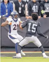  ?? BEN MARGOT/ASSOCIATED PRESS ?? Denver cornerback Aqib Talib (21) and Oakland receiver Michael Crabtree brawl during the Raiders’ win on Sunday. The fight apparently is a continuati­on of a spat that happened last season.