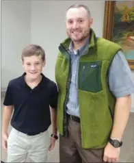  ?? SUBMITTED ?? Mason Harris, 10, and his father, Dr. Pete Harris, have volunteere­d for many events for the Heber Springs Area Chamber of Commerce. Pete serves on the board of directors, but he and Mason volunteere­d before Pete was on the board. “I think if other kids...