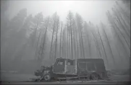  ?? MEL MELCON/LOS ANGELES TIMES ?? Burned trees rise above a truck destroyed by the Dixie Fire in the town of Greenville.