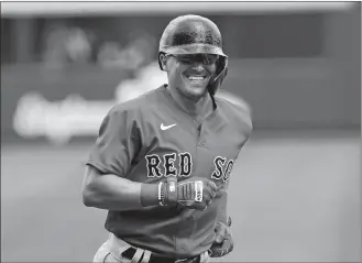  ?? JOHN BAZEMORE/AP PHOTO ?? Boston Red Sox second baseman Kike Hernandez rounds the bases after hitting a home run during a spring training game against the Atlanta Braves on Monday in North Port, Fla.