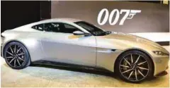  ??  ?? Bond’s Spectre Aston Martin (left) has its roots in the Aston Martin of old (below), which had a radar screen and ejector seat (inset).
