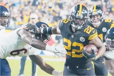  ?? GENE J. PUSKAR/AP ?? Rookie Najee Harris scores a TD in the Steelers’ win over the Bears on Monday. He has played a key role in the Steelers’ win streak, sparking an effective ground game.