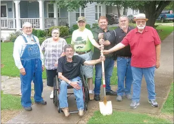  ?? Westside Eagle Observer/SUSAN HOLLAND ?? Members of the Gravette City Council, along with Mayor Kurt Maddox and city clerk Mike von Ree (seated), break ground July 26 for the city’s new 1.38-mile walking and bike trail. The 8-foot-wide trail will go past the upper elementary and middle...