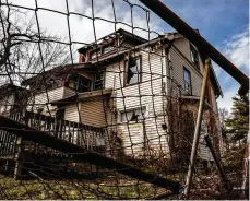  ?? JIM NOELKER PHOTOS / STAFF ?? This Southern Dayton View duplex in the 500 block of Lexington Avenue has the most delinquent taxes of any residentia­l property on the list.