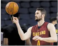  ?? AP/MARCIO JOSE SANCHEZ ?? Kevin Love of the Cleveland Cavaliers missed most of Game 6 and all of Game 7 in the NBA Eastern Conference finals with a concussion. His status tonight for Game 1 of the NBA Finals remains uncertain.