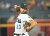  ?? MICHAEL CHOW/THE REPUBLIC ?? Arizona Diamondbac­ks pitcher Zac Gallen throws against the Oakland Athletics during the first inning at Chase Field on Tuesday.