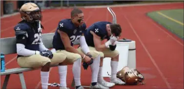  ?? TIM PHILLIS - FOR THE NEWS-HERALD ?? John Carroll players lament the final moments of a 23-20loss to Randolph-Macon on Nov. 17.