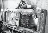  ?? Santiago Mejia / The Chronicle ?? SALVAGED GOODS: A battered radio sits at the campsite where Masatada Nishibori lives.