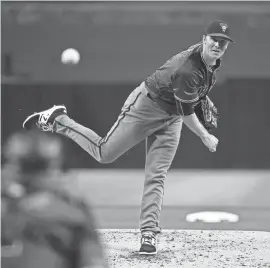  ?? GETTY IMAGES ?? Diamondbac­ks starting pitcher Zack Greinke delivers during the first inning of Wednesday night’s late game against the Padres at Petco Park in San Diego. Visit dbacks.azcentral.com for a game recap.