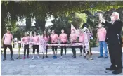  ?? ( Haim Zach/ GPO) ?? PRESIDENT REUVEN RIVLIN fires the starting gun for cancer awareness runners.