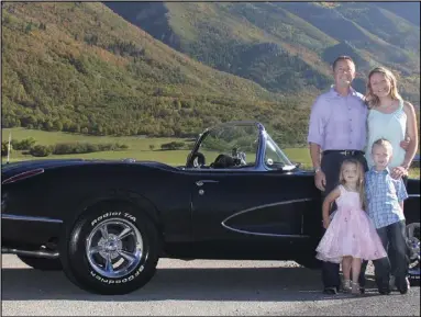  ?? Kathy Anderson ?? Colin Logue with his wife Shessann, daughter Jackie and son Ashton standing next to their 1958 Corvette.