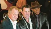  ?? JOHN MCHUGH/AP ?? David Soul, from left, Paul Michael Glaser and Antonio Fargas, stars of the original “Starsky and Hutch” television series, watch at an event in 2004.