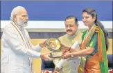  ?? PTI ?? Prime Minister Narendra Modi confers Prime Minister’s Award for Excellence in Public Administra­tion to Chamoli DM Swati Bhadauria, in New Delhi on Thursday.