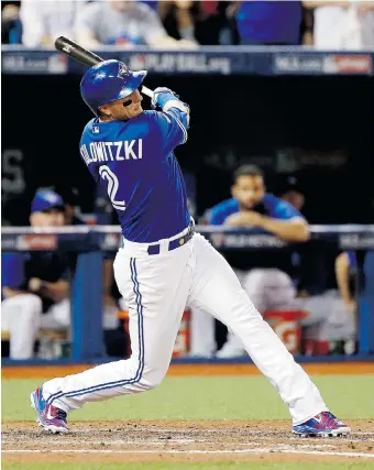  ?? MATT SLOCUM/The Associated Press ?? Toronto Blue Jays’ Troy Tulowitzki rips a bases-loaded double to score three runs in Game 5 action of the ALCS
in Toronto Wednesday. The Jays were 7-1 winners, but trail the series 3-2 heading back to Kansas City.