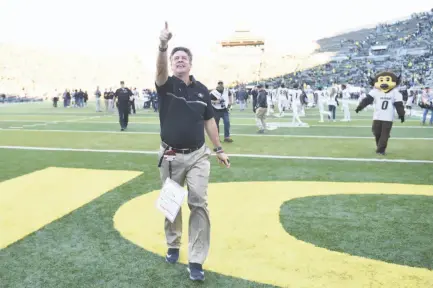  ?? Steve Dykes / Getty Images ?? Mike MacIntyre leaves the field at Oregon, above, with a 41-38 win last month. What’s he’s accomplish­ed with Colorado is no surprise to those who saw his success at San Jose State (celebratin­g a 2012 win, below, with cornerback Jimmy Pruitt).