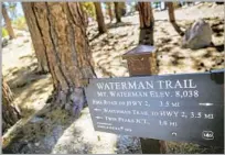  ??  ?? SIGNAGE on the trail helps hikers keep track of their progress. Remember to take water and sunscreen for the haul.