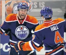  ?? Dan Riedlhuber, Reuters ?? Sam Gagner, left, celebrates one of his four goals against the Chicago Blackhawks with linemate Taylor Hall on Thursday night.