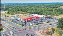  ?? MORRIS/ THE OKLAHOMAN] ?? This drone image shows the now-closed Smart Saver grocery store at intersecti­on of NE 23 Street and Martin Luther King Avenue. [DAVID