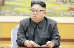  ?? AFP PHOTO / KCNA VIA KNS / STR ?? Kim Jong Un at a meeting with a committee of the Workers’ Party of Korea about a hydrogen bomb test.