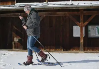  ?? DIGITAL FIRST MEDIA FILE PHOTO ?? While snow is not in the forecast for the start of 2019, it will arrive eventually. You can enjoy winter hiking with a pair of snowshoes. Walking in snowshoes is an effective exercise during winter months, as it is an easy concept for anyone to learn, and users will exert a lot more energy than hiking regularly. Add a pair of poles to the hike for a good upper body and cardiovasc­ular workout.