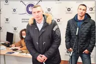 ?? Genya Savilov/AFP / TNS ?? Kyiv mayor Vitali Klitschko, left, and his brother and fellow former Ukrainian boxer Wladimir Klitschko speak to the media during visit to a volunteers recruitmen­t center on Feb. 2.