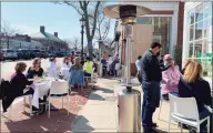  ?? Grace Duffield / Hearst Connecticu­t Media ?? People dined in New Canaan outdoors during the winter, but many more came to Sole and other restaurant­s on Elm Street on a warm spring-like Thursday.