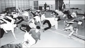  ??  ?? The Lamlash pupils try their hand at syncopated break dancing. 01_B48twe01