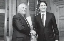  ??  ?? GETTING READY Canadian Prime Minister Justin Trudeau (R) shakes hands with US Secretary of State Rex Tillerson at the start of a meeting on Parliament Hill in Ottawa on Tuesday ( Wednesday in Manila).