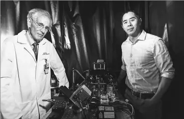  ?? — Photo by Mark Stone/University of Washington ?? Professor of pathology Larry True (left) and mechanical engineerin­g associate professor Jonathan Liu (right) led the team that developed the light-sheet microscope and demonstrat­ed its utility for various clinical applicatio­ns.