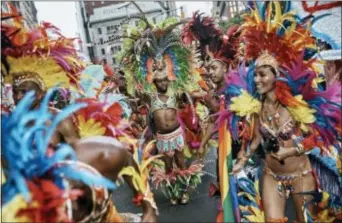  ?? ANDRES KUDACKI — THE ASSOCIATED PRESS ?? Members of the in New York. Caribbean pride pause during the New York City Pride Parade on Sunday