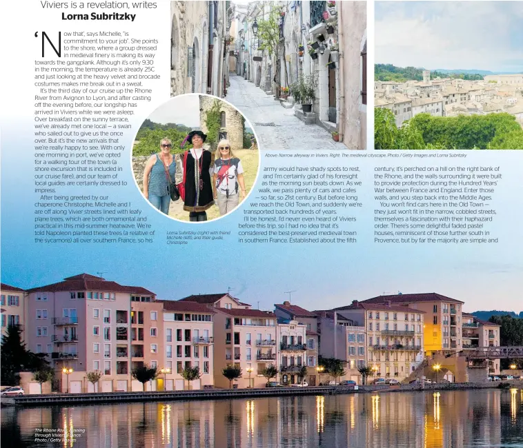  ??  ?? The Rhone River, running through Viviers, France. Photo / Getty Images Lorna Subritzky (right) with friend Michelle (left), and their guide, Christophe. Above: Narrow alleyway in Viviers. Right: The medieval cityscape. Photo / Getty Images and Lorna Subritzky