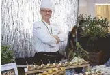  ??  ?? MacroAsia Catering Services chef Roberto Usai prepares a delectable spread of gourmet selections inspired by the different destinatio­ns of the Singapore Airlines Boeing 787-10 Dreamliner.