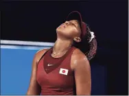  ?? David Ramos / Getty Images ?? Naomi Osaka reacts after a point against Marketa Vondrousov­a during the third round of the tennis competitio­n at the 2020 Summer Olympics on Tuesday in Tokyo.