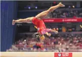  ?? JEFF ROBERSON/ASSOCIATED PRESS ?? Simone Biles competes on the balance beam during Sunday night’s U.S. Olympic Trials in St. Louis.