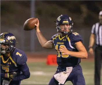  ?? John Wareham/COC Sports Informatio­n ?? Wyatt Eget looks for a receiver in COC’s game against Golden West on Saturday at College of the Canyons. In his first start of the season, he completed 19-of-35 passes for 245 yards, two touchdowns and one intercepti­on.